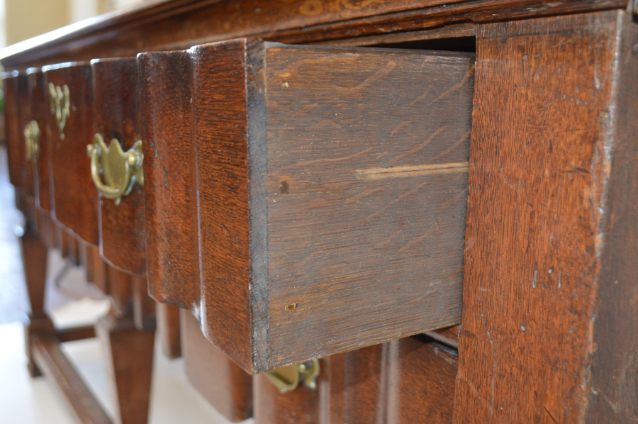 Discover our collection of 19th-century Dutch walnut bureaus. Features like delicate boxwood inlay, drawers with brass handles, and original keys for authenticity await. Shop now for the perfect vintage touch!