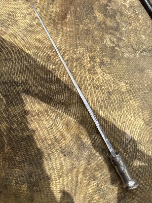 An early 20th century silver plated sword with with added rubber foot.