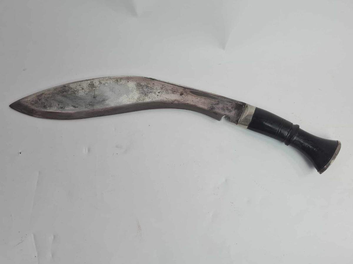 Discover our exceptional range of antique kukris! Experience owning a piece of history with our early to mid 20th-century bone-handled kukri, complete with a black leather sheath and two knives. Shop now!