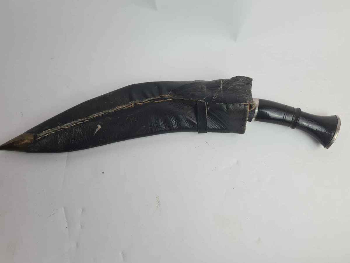 Discover our exceptional range of antique kukris! Experience owning a piece of history with our early to mid 20th-century bone-handled kukri, complete with a black leather sheath and two knives. Shop now!