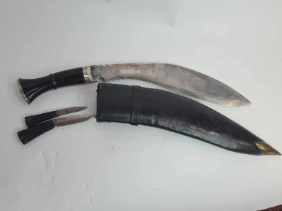 Discover our exceptional range of antique kukris! Experience owning a piece of history with our early to mid 20th-century bone-handled kukri, complete with a black leather sheath and two knives. Shop now!