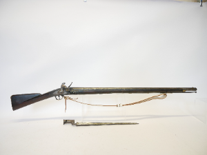 A lovely Flintlock volunteer Brown Bess musket by Sargant and Son with bayonet, 39inch barrel with Birmingham proof marks, full length stock with brass furniture, together with a socket bayonet and a reproduction leather sling.

Dimensions: 135cm long.
