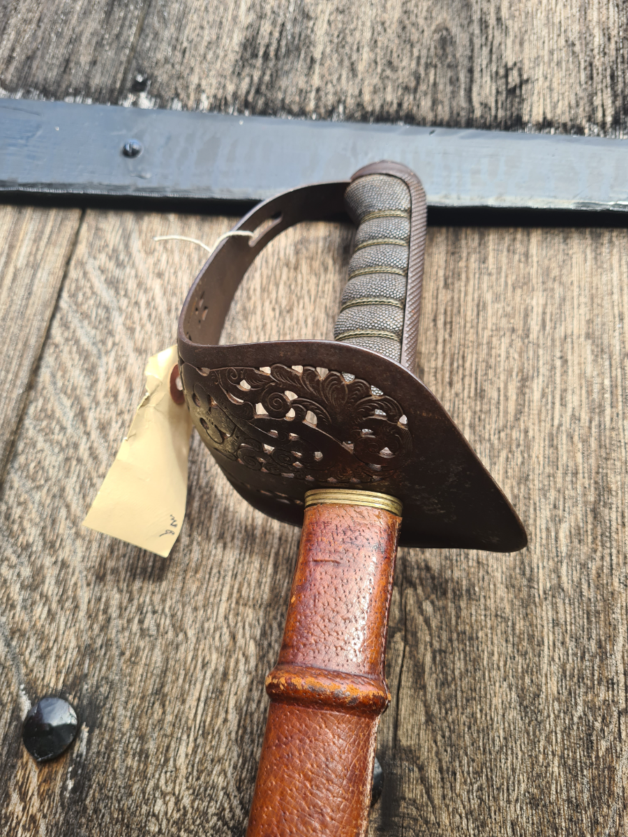 Discover our 1897 pattern officer's dress sword, complete with scabbard. This unique piece is by F.W Flight, Winchester. Shop now for antique weaponry.