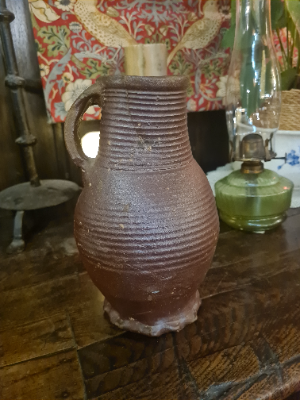 Discover our unique 15th/16th-century German glazed stoneware jug. Repaired and kept in good condition. Once a proud part of Boothmans' collection. Don't wait, own this historic treasure today!