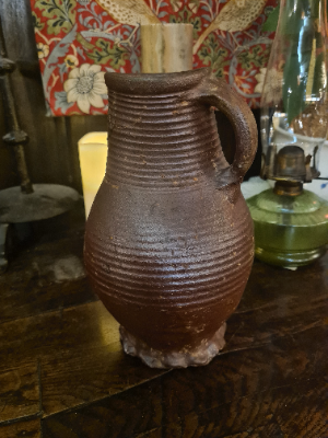 Discover our unique 15th/16th-century German glazed stoneware jug. Repaired and kept in good condition. Once a proud part of Boothmans' collection. Don't wait, own this historic treasure today!