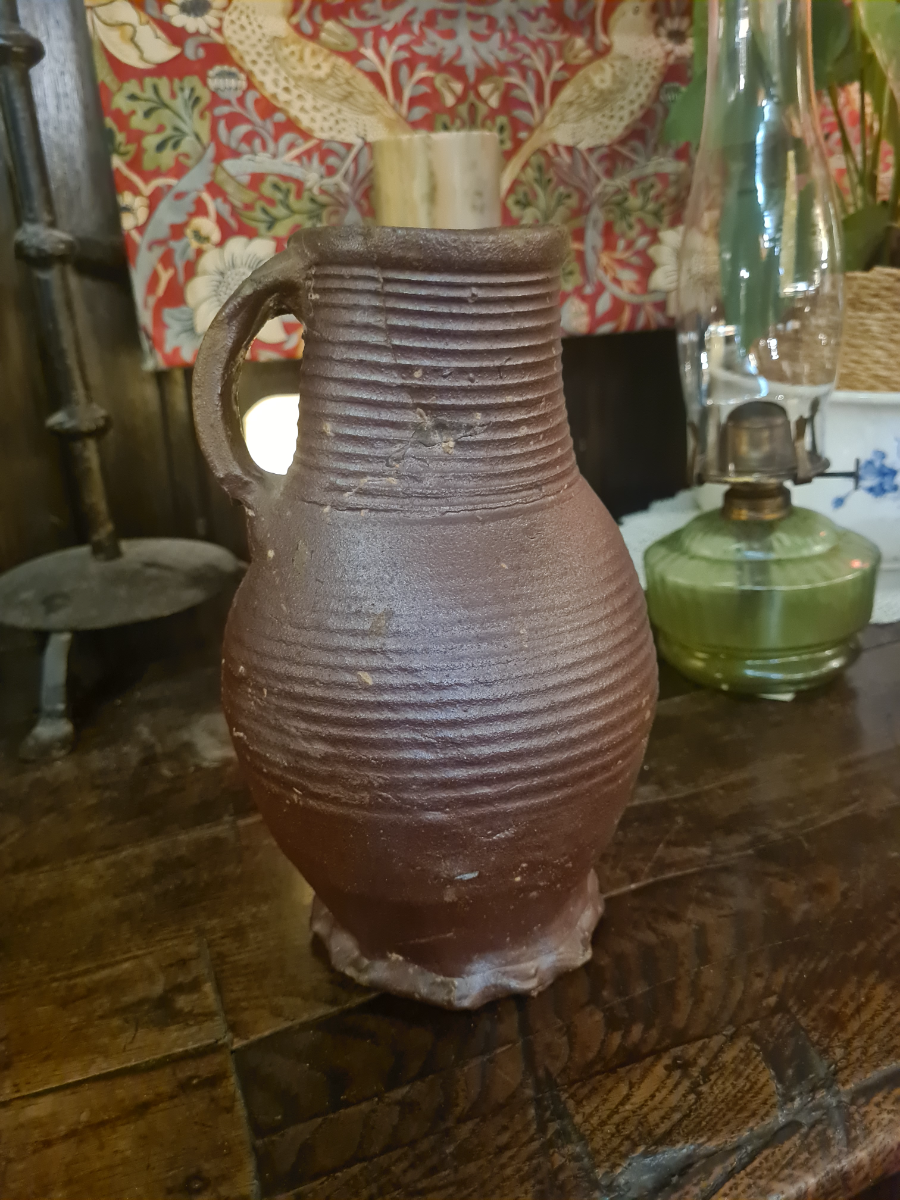 Discover our unique 15th/16th-century German glazed stoneware jug. Repaired and kept in good condition. Once a proud part of Boothmans' collection. Don't wait, own this historic treasure today!