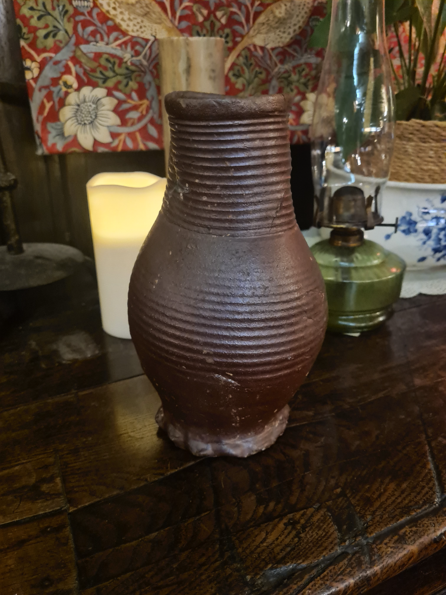 Discover our unique 15th/16th-century German glazed stoneware jug. Repaired and kept in good condition. Once a proud part of Boothmans' collection. Don't wait, own this historic treasure today!
