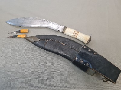 Discover our range of mid 20th century Nepalese bone-handled Kukris. Explore, shop now, and own a piece of history. High-quality, well-detailed, and authentically worn.