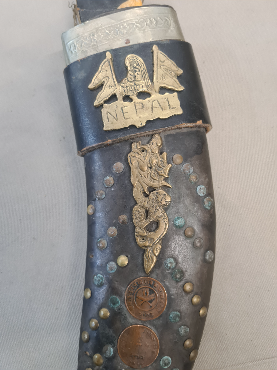 Discover our range of mid 20th century Nepalese bone-handled Kukris. Explore, shop now, and own a piece of history. High-quality, well-detailed, and authentically worn.