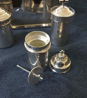 Discover our collection of vintage, silver-plated Holy Oils Stocks. Explore now for unique, functional pieces with tight-fitting lids. Don't miss out, shop today!