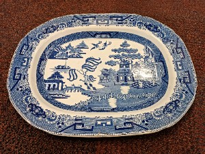 Discover our late 18th-century transfer printed antique blue willow pattern, featuring crazing and an impressed crown mark. Expertly crafted in England, and in excellent condition. Shop now!