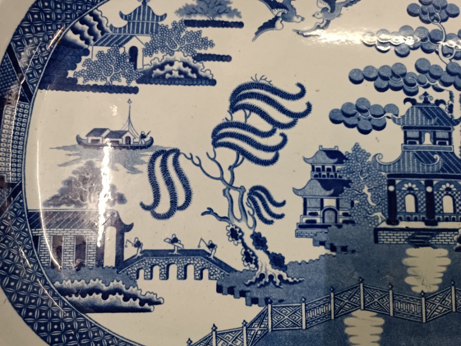 Discover our late 18th-century transfer printed antique blue willow pattern, featuring crazing and an impressed crown mark. Expertly crafted in England, and in excellent condition. Shop now!