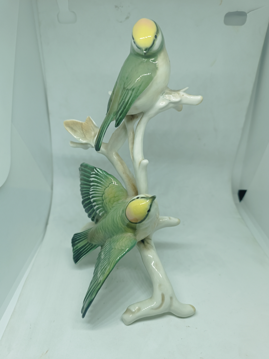 Explore our collection of unique German porcelain featuring a magnificent ceramic model of two Golden-Crowned Kinglets, circa 1869-1990. Discover the high-quality craftsmanship and fine details today.