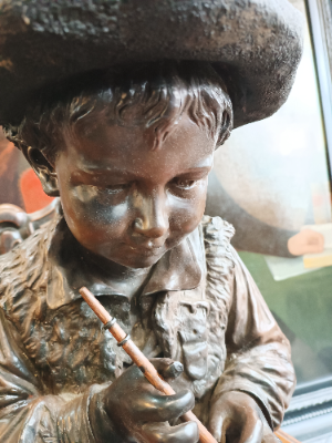 Large Bretby Terracotta Figure Of A Boy Clasping A Flute