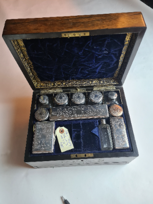 Explore our collection of late Victorian vanity boxes. Made of mahogany, housing 11 silver plated vessels & a secret compartment. Act now for this rare find!