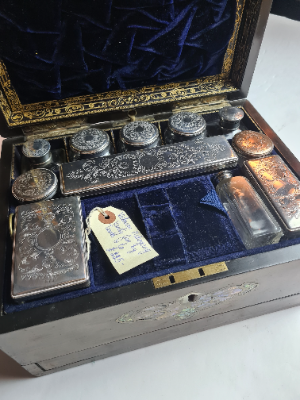 Explore our collection of late Victorian vanity boxes. Made of mahogany, housing 11 silver plated vessels & a secret compartment. Act now for this rare find!