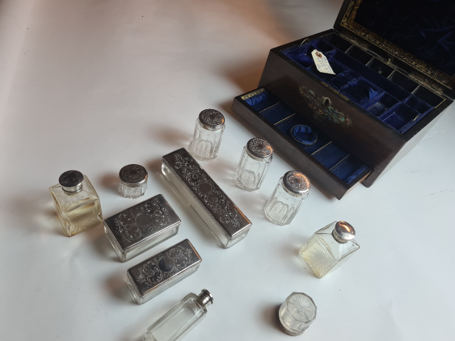 Explore our collection of late Victorian vanity boxes. Made of mahogany, housing 11 silver plated vessels & a secret compartment. Act now for this rare find!