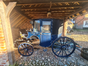 Discover our 1860 Brougham horse-drawn carriage by Frederick Sanderson. Built for comfort and city travel, it seats 2-4 people. Come view this historical gem today.