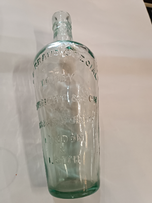 Discover a 19th-century Toddy Bottle by C. Wright & Son Ltd, London. This unique piece is 10 inches tall, perfect for mixing spirits and sugar. Shop now for quality antiques!