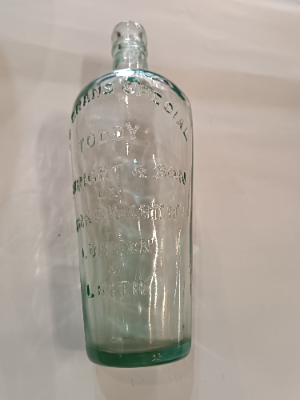Discover a 19th-century Toddy Bottle by C. Wright & Son Ltd, London. This unique piece is 10 inches tall, perfect for mixing spirits and sugar. Shop now for quality antiques!