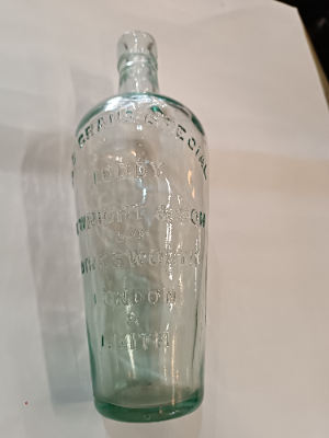 Discover a 19th-century Toddy Bottle by C. Wright & Son Ltd, London. This unique piece is 10 inches tall, perfect for mixing spirits and sugar. Shop now for quality antiques!