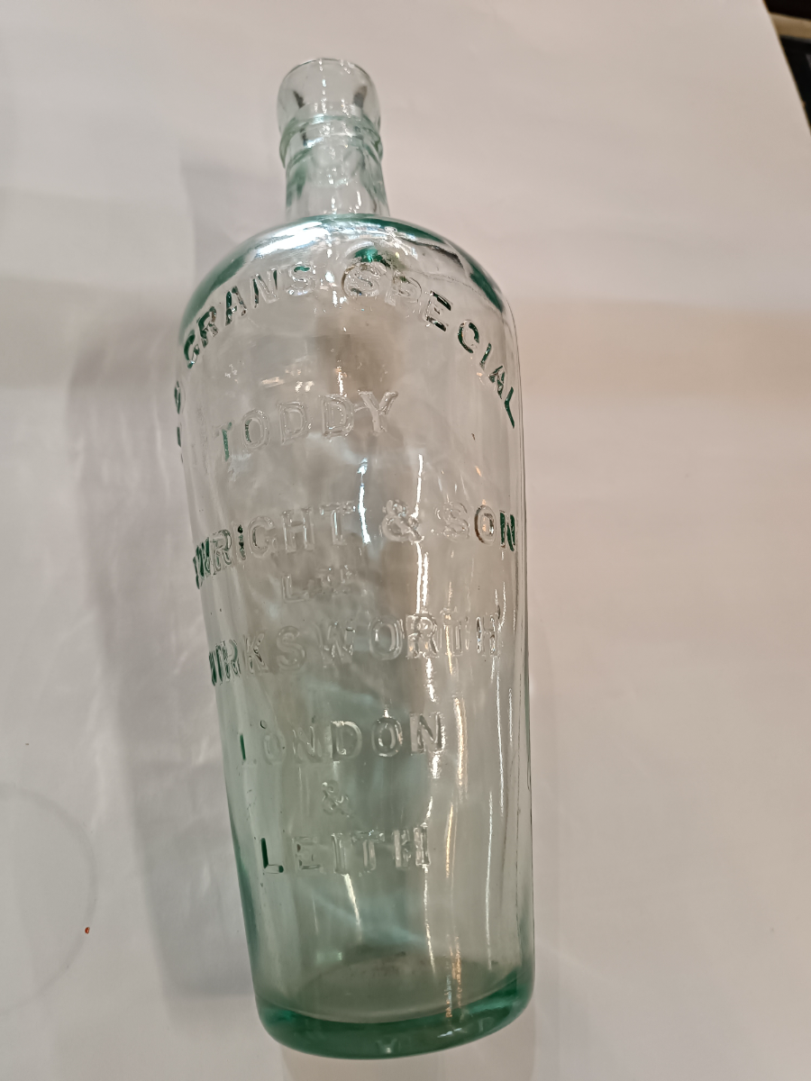 Discover a 19th-century Toddy Bottle by C. Wright & Son Ltd, London. This unique piece is 10 inches tall, perfect for mixing spirits and sugar. Shop now for quality antiques!