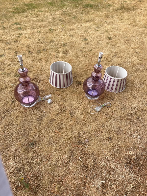 A stylish pair of brown glass table lamps, each featuring an elegant double-curved neck with tinted glass detailing, set upon a rounded glass base.

The lamps are complemented by designer striped silk shades, creating a sophisticated and decorative look. Both lamps have been PAT tested for electrical safety.

The shades are described as reproduction/vintage style and measure approximately 22 cm high × 26 cm diameter.

Overall lamp dimensions: approximately 59 cm high × 26 cm wide
Price: £395 for the pair
UK delivery: £40