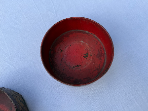A lovely pair of Regency red paper mache bottle coasters. Circa 1810. As seen condition. Sealed bottle not included.