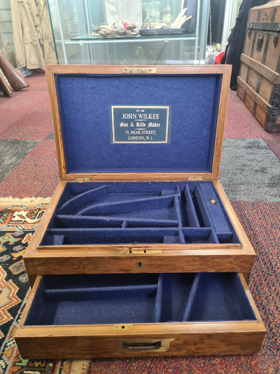 Explore our collection of mid-20th century artifacts. Buy the unique John Wilkes two-draw pistol and gambling token case, size 41x27 cm. Act now!