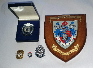 Discover unique items with provenance like a signed Christmas card from Queen Elizabeth, The Queen Mother. Explore SO19 badges, a marksman's medal, and more! Buy now!