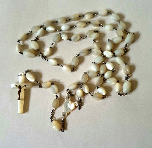 Discover our stunning vintage Mother of Pearl Shell Rosary, complete with a lovely cotton bag. Shop now to add elegance & devotion to your spiritual routine!