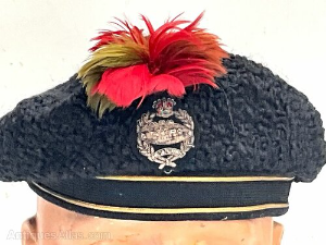 Royal Tank Regiment Officers Full Dress Astrakhan Beret, good early example with bullion embroidered regimental badge to the centre. Black mohair band with two gold wire strips bordering. Complete with the regimental feather hackle plume. Interior with brown leather sweatband worn and torn cloth lining. Good overall condition. Reference BBS
 Tel: +44 7505 165 843 We accept online payments for all our items listed: Bank transfer cash on collection or if wishing over the phone using your debit or credit cards, also doing layby payments plan, or email giving your address details & contact number and we shall send you your items invoice to make payment with your card. Send your request to - john.strong2@gmail.com