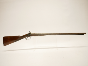 Discover Showell's 12 bore double barrel shotgun, an antique with 29.5inch Damascus barrels. No licence needed. Explore and own it now!