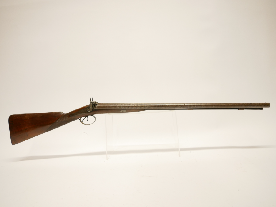 Discover Showell's 12 bore double barrel shotgun, an antique with 29.5inch Damascus barrels. No licence needed. Explore and own it now!