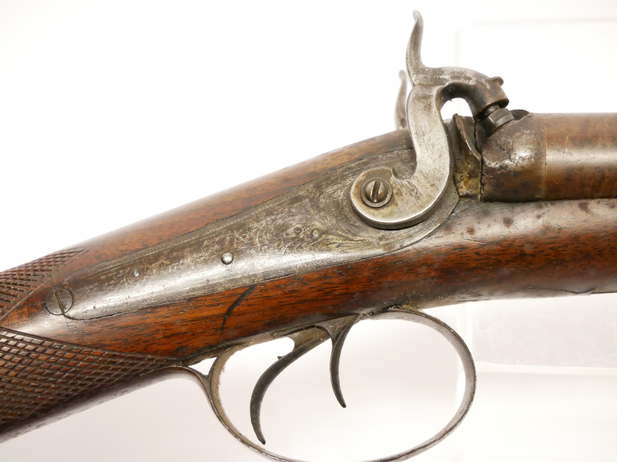 Discover Showell's 12 bore double barrel shotgun, an antique with 29.5inch Damascus barrels. No licence needed. Explore and own it now!