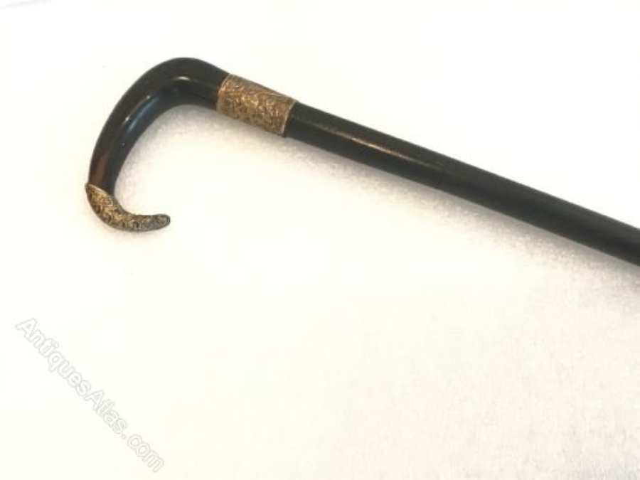 Stunning  Horned gold handled walking stick / sword