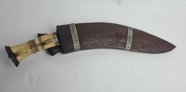 Discover our WW2 period bone hilted kukri, ideal for collectors. Admire its unique Newari carving and quality nickel plating. Named to Rifleman Osborne, it's in mint condition!