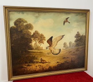 Original large oil painting on canvas, signed by artist G Millhouse in the bottom right corner. The painting depicts a pair of kestrels hunting in unison across an open landscape, with one swooping down towards a large rodent while the other flies overhead. Warm earth tones and golds, delicate brushwork and fine attention to detail bring the birds and surrounding landscape to life. Presented in an ornate gilt frame. Dimensions: 31.5 inches high × 39.5 inches wide.
