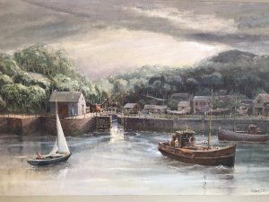 Original oil painting on board depicting a harbour with fishing boats, a canal waterway and houses. Intricate detail and vivid colours capture the waterfront beneath a stormy sky. Signed by Hong Kong-based artist WAN and presented in a cream wooden frame with a painted border.