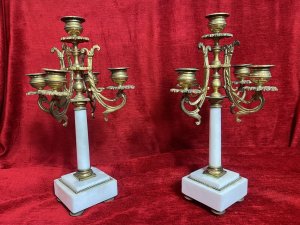 Pair Of French Louis XVI Style Bronze Ormolu/Marble Five Branch Candelabras Circa - 1890 Composition - Bronze Ormolu Listing Description Magnificent French Late 19th Century Bronze Ormolu And White Marble Five Branch Pair Of Candelabras In The Louis XVI Style. Upon The Leading Central Marble Column Pedestal Stands The Tallest Candle Sconce As A Pinnacle. Four Acanthus Scroll Arms Sit Underneath And Support The Candle Sconces In Classical Urn Shape, All Sconces Decorated With Folate Shaped Drip Pans. Set Upon Square Marble Bases With Quadrant Of Bun Feet. Exceptional Parisian Pair In Lovely Condition. Dimensions In Inches Height 13" X Width 6' x Depth 3.5 SQ Base For Further Information Please Call 07707 488 566 Thank-you