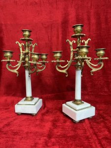 Pair Of French Louis XVI Style Bronze Ormolu/Marble Five Branch Candelabras Circa - 1890 Composition - Bronze Ormolu Listing Description Magnificent French Late 19th Century Bronze Ormolu And White Marble Five Branch Pair Of Candelabras In The Louis XVI Style. Upon The Leading Central Marble Column Pedestal Stands The Tallest Candle Sconce As A Pinnacle. Four Acanthus Scroll Arms Sit Underneath And Support The Candle Sconces In Classical Urn Shape, All Sconces Decorated With Folate Shaped Drip Pans. Set Upon Square Marble Bases With Quadrant Of Bun Feet. Exceptional Parisian Pair In Lovely Condition. Dimensions In Inches Height 13" X Width 6' x Depth 3.5 SQ Base For Further Information Please Call 07707 488 566 Thank-you