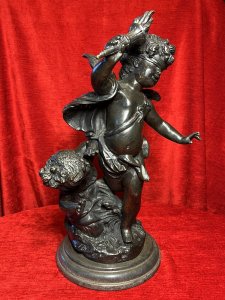 Bronze Sculpture Of Blind Folded Eros With Young Psykhe After Auguste Moreau Circa - 1890 Composition - Bronze Brief History Of Sculptor Auguste Moreau 1834-1917 Paris Born Moreau Was The Youngest Of Three Brothers Born Of Sculptor Jean-Baptiste Moreau. His Figurative Sculptures Are Highly Renowned For Their Quality, Realism And Beauty. In 1861 Auguste Made His debut At The Salon Where He Exhibited Regularly Until 1913. His Is Best Known For Subjects Of Allegorical Scenes Including Cupids And Young Children As Well As Birds And Sensuously Clad Young Maidens. Listing Description Wonderful French Myological Bronze Sculpture Showpiece After Auguste Moreau Of Winged Eros As Cupid God Of Love, Portrayed Acting Blindly So His Eyes Are Covered With A Blindfold As He Wields The Flame of Love (Lit Torcher) In Right Arm. Young Psykhe Kneeling Waving (Left Side) To Eros Wondering Why She Cannot Been Seen By Him. Fine Quality Figures In Exception Detail With Original Rich Patina. Both Figures Set Upon Circular Plinth Of Abundant Grasses And Foliage With Black Marble Stepped Pediment. Provenance Part Of Lord Hill Museum Private Collection Dimensions In Inches Height 17" Width 9" Base Diam 8"