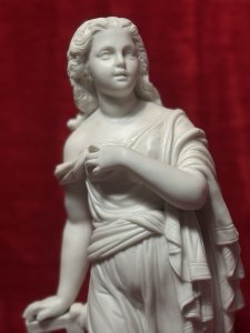 Antique Parian Ware Robed Lady Standing With Lyre Figurine Sculpture C1860 Circa - 1860 Composition - Hard Paste Porcelain Listing Description Antique Fine Quality Parian Ware Statue Of Ornately Robed Lady Standing Next To Lyre Instrument. Exquisitely Fine Details Of Face Hands & Feet. Chip Visible On Front Cylindrical Base. No Damage To Figure. Dimensions In Inches Height 14.5" X Width 6" For Further Information Please Call The Museum Curator On 07707 488566 Thankyou.