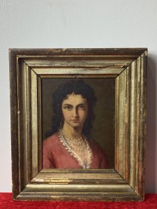 Late 19C Oil Portrait Of Lady Wearing Pearl Necklace Signed By Artist J Axmann. Circa - 1866 Composition- Oil On Board Front Facing Head And Shoulder Portrait Of Unknown Angelic Lady Sitter With Dark Hair, Hazel Eyes And Pronounced Facial Features. Wears Pink Gown Decorated With Eyelash Lace Detail And Eye Catching Three String Pearl Necklace. Exceptional Detailed Portrait By Very Accomplished And Well Known Artist J Axmann. Signed Top Right Corner By Artist And Set In Gilt Wood Frame. The Frame Showing Signs Of Wear Due To Age. Dimensions In Inches Height 11.5” Width 9 3/4”