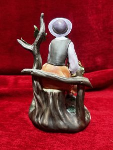 Capodimonte Porcelain Tale Of Boo Peep Figurine Circa- Vintage Composition - Hard Paste Porcelain. Listing Description Young Maiden Sitting On Picket Fence With Basket Of Apples And Lamb Companion Gazing Up For Apple Reward. Finely Detailed Porcelain Charming Subject. Dimensions In Cms Height 20cm X Width 14cm X Depth 15cm