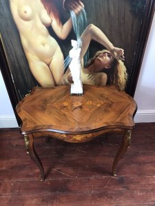 Beautiful French Marquetry And Ormolu Mounted Serpentine Shaped Salon Table Louis XVI Style For Queen Of France Marie Antoinette Exceptional Walnut Table With Serpentine Shaped Top With Gadrooned Edge And Top Skirt. Marquetry Inlaid Oval Panels Displaying Floral Inlay Bouquets In Exotic Woods Including Olive Wood, Satinwood, Rosewood, Kingwood & Yew Wood. Original Condition Beautiful Elegant Ladies Piece Provenance From Paris Collector And Purchased By Lord Hill Museum 2010 Now Part Of Extensive Collection Dimensions In Inches Height 27” Width 34” Depth 21” Weight Approx 28Kg
