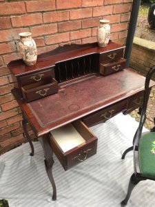 Ladies Period Art Nouveau Spanish Mahogany Writing Table With Chair Circa - 1890 Composition - Spanish Mahogany Listing Description Highly Desirable Ladies Art Nouveau Writing Table With The Top Compartment With Central Pidgeon Holes And Surrounding Double Drawer Stacks. Rectangular Desk With Burgundy Leather Writing Top With Ornate Tooled Edging And Three Integral Drawers. All Seven Drawers With Original Brass Ormolu Mounted Handles. Set Upon Ornate Splayed Sabre Legs. Complete With Elegant Arts And Crafts Carved Chair With Floral Tapestry Seat. Stunning Period Antique Piece For Ladies Office/ Study. Sturdy And Usable Collectors Item. For More Pictures Or Further Assistance Please Call 07376618513 Provenance Part Of Lord Hill Private Collection Condition - Period Antique Original Signs Of Scratches/ Scuffs/ Wear And Minor Repair To Desk Edge Conducive To Age. Dimensions In Inches Height 36" Width 36" Depth 20"