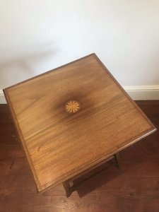 Antique Edwardian Fine Satinwood Centre Table With Herringbone Inlays And Centre Motif Circle Of Satinwood With Inlaid Stringing On Tapered Legs With Bottom Gallery Shelf For Display In Good Condition With Some Very Slight Fine Marks Conductive To Age And Usage Dimensions In Inches Height 27” Top 19” Square Bottom Gallery Shelf 13” Square