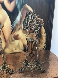 Pair Of Ornate Decorative Cast Iron Easels Stunning Fairy And Cherub Ornamental Top With Decorative Vines Decorative 3 Legged Stand With Pendulum Style Back Leg On Chain Decorative Acanthus Leaf Painting Holder Support Antiqued Gold Colouring Exceptional Heavy Quality Pieces For Table Top Displays Of Fine Arts Classical pictures not included Easels Approx 2kg In Weight Dimensions In Inches Height 47” Width 10.5” Depth 4.5”p