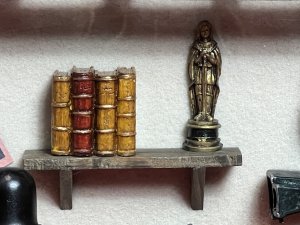Vintage Diorama Of Film Directors Studio With 1920's Icons Circa - Vintage Composition - Mixed Media Paper/Resin/ Glass/ Wood Listing Description Stylish Diorama Of 1920's Hollywood Directors Studio In Room Of Textured Wallpaper With Wood Exposed Beams, Showcasing Large Camera On Tripod Stand. Wall Shelf With Prevalent Oscar Film Award And Books And Walls Dec0orated With Film Advertisements Including 'Grandma's Boy' by Harold Lloyd & 1936 Film 'Desire ' And Hollywood Stars Including Elvis And Marlyn Monroe. The Floor Displayed With Rolled Scripts And Film Reels With Clapboard, A Rustic Foldable Chair Reads 'Director' Next To Ornamental Floor Lamp. Diorama Set Inside Wooden Frame With Wall Hanging Display On Reverse. Fine Diorama For Hollywood Film Enthusiast. Dimensions In Inches Height 13 3/4 X Width15.5" X Depth 3"